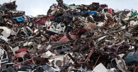 A junkyard full of scrap cars.